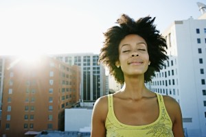 Mixed race woman on urban rooftop